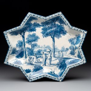 A rare blue and white Dutch Delft star-shaped dish with travellers in a landscape, early 18th C. — photo 1