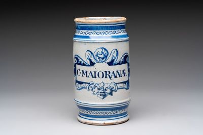 A rare blue and white Dutch maiolica albarello with a cherub head and a mascaron, 1st quarter 17th C.