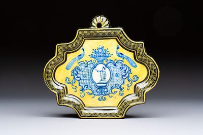 A rare blue and white yellow-ground Dutch Delft plaque with a black border, 18th C.