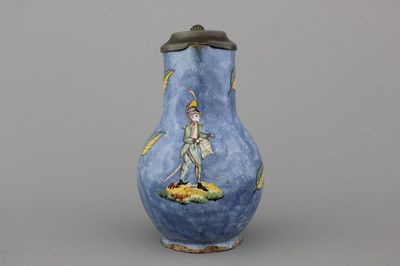 A rare Brussels faience blue ground jug with a soldier, 18th C.