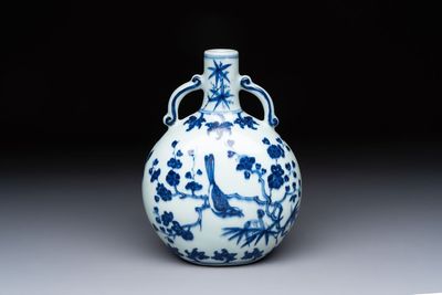 A rare Chinese blue and white moonflask with a bird on a blossoming branch, Yongzheng/Qianlong
