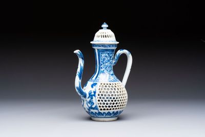 A rare Chinese blue and white reticulated double-walled ewer and cover with floral design, Kangxi