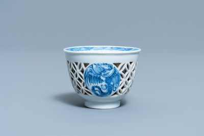 A rare Chinese blue and white reticulated double-walled 'fenix' cup, Transitional period