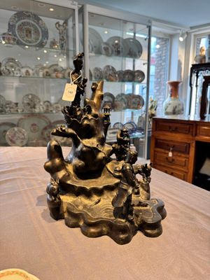 A rare Chinese bronze group depicting two immortals and various animals in a mountainous landscape, Ming — photo 1