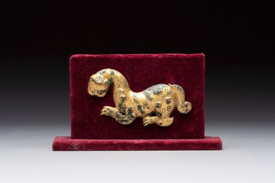 A rare Chinese gilt-bronze 'tiger' ornament, Han