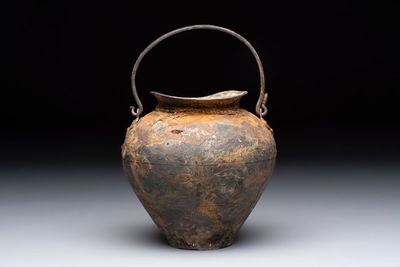 A rare Chinese parcel-gilt silver handled jar with floral scroll design, Tang