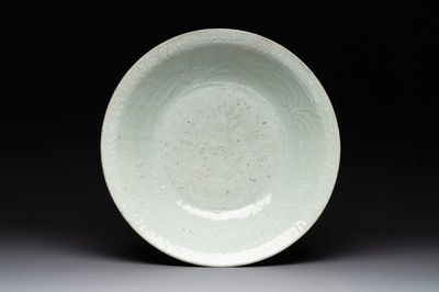 A rare Chinese Swatow slip-decorated pale-green-glazed 'dragon' dish, Ming