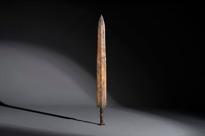 A rare Chinese turquoise-inlaid parcel-gilt bronze sword, Zhou