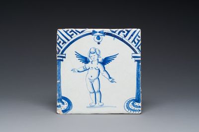 A rare Dutch Delft blue and white tile with a large cherub below a gate, 1st half 17th C.