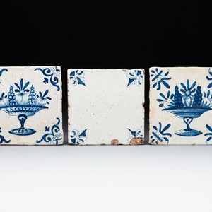 A rare 'empty' blue and white Dutch Delft tile and two 'fruit bowl' tiles, 17th C. — photo 1