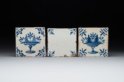 A rare 'empty' blue and white Dutch Delft tile and two 'fruit bowl' tiles, 17th C.