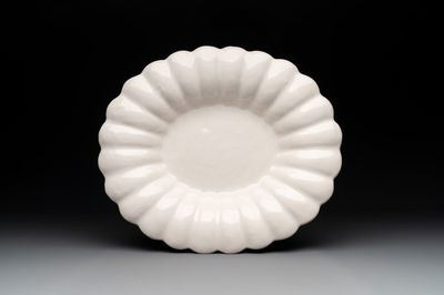 A rare gadrooned oval white Delftware dish, 17th C.