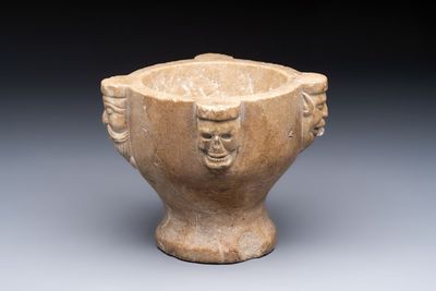 A rare Italian marble ‘Poison Mortar’ with skulls and masks, 17th C.