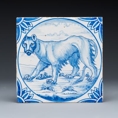 A rare large blue and white Dutch Delft tile with a leopard, Ravesteijn, Utrecht, 19th C.