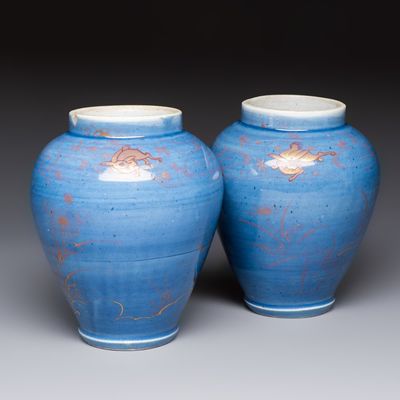 A rare pair of Japanese gilt-decorated powder-blue-ground vases, Edo, late 17th C.
