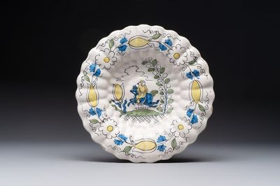 A rare polychrome Dutch Delft 'Chinese horserider' dish, 17th C.