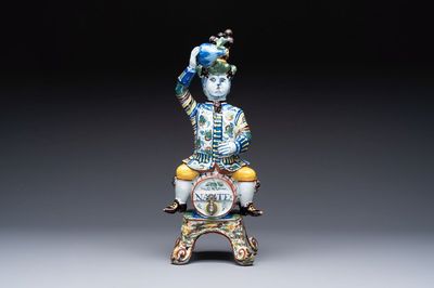 A rare polychrome Dutch Delft figural wine cistern and cover, 18th C.