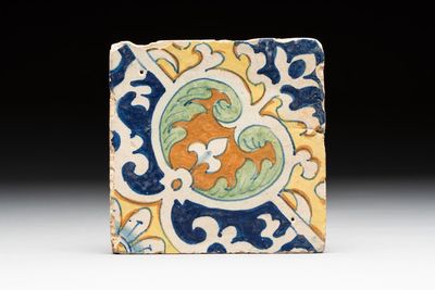 A rare polychrome Dutch Delft maiolica 'nier' or 'kidney' ornament tile, late 16th C.