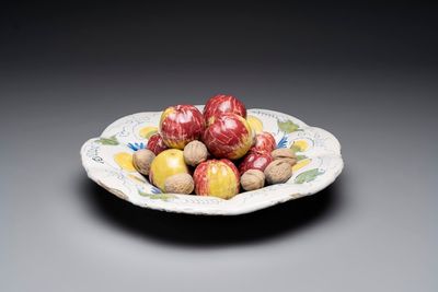 A rare polychrome Dutch Delft trompe-l'oeil dish with apples and walnuts, 17th C.