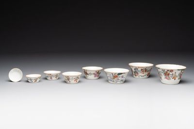 A rare set of eight Chinese famille rose 'Sanxing' nesting bowls, Tongzhi mark and of the period