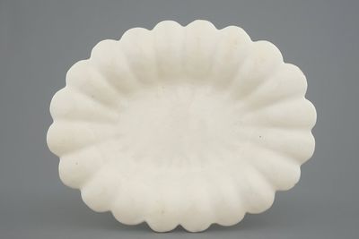A rare white Delft oval gadrooned dish, 17th C.