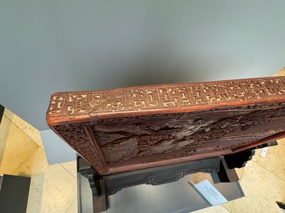 A rectangular Chinese carved red lacquer 'dragon' table screen, later wooden stand, Qianlong — photo 33