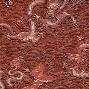 A rectangular Chinese carved red lacquer 'dragon' table screen, later wooden stand, Qianlong — photo 2