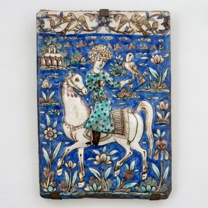 A rectangular moulded tile with a falconer, Qajar, Iran, 19th C. — photo 1