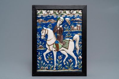 A rectangular Qajar relief-moulded tile with a prince on horseback, Iran, 19th C.