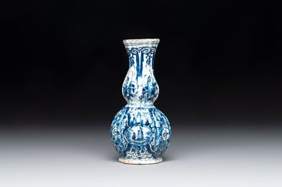 A ribbed blue and white Dutch Delft double gourd vase, 18th C.