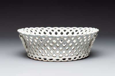 A round white-glazed reticulated pottery basket, Brussels or France, 18th C.