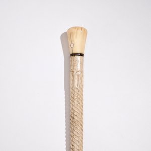 A scrimshaw whalebone cane with a sperm whale tooth handle, 19th C. — photo 2