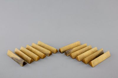 A set of 12 rare polished rhinoceros horn knife rests, ca. 1900