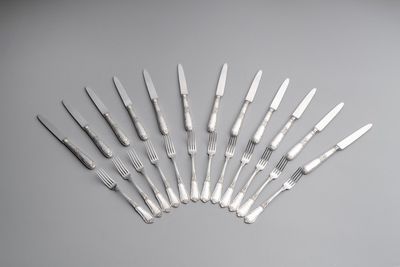 A set of 12 silver dessert forks and dessert knives, 835/000, Wolfers Frères, Brussels, 20th C.