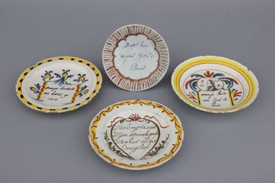 A set of 4 Dutch Delft polychrome royalist orangist text plates 17/18th C.
