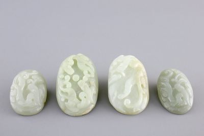 A set of 4 pale celadon jade carvings, 19/20th C.