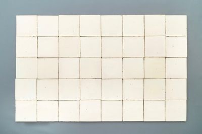 A set of ca. 80 plain white Dutch Delft tiles, 18th C.