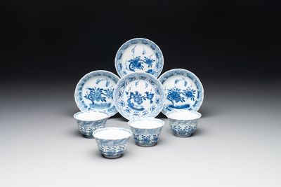 A set of four Chinese blue and white cups and saucers, flower mark, 19th C.