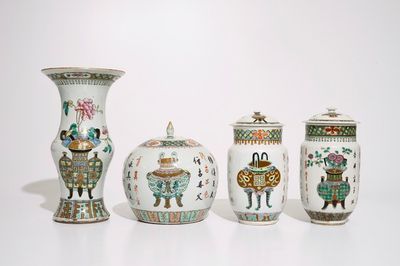 A set of matching Chinese famille verte vases and covers, 19th C