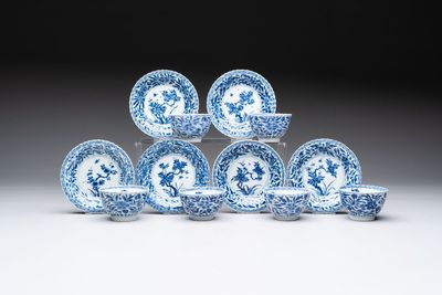 A set of six Chinese blue and white cups and saucers with floral design, Kangxi