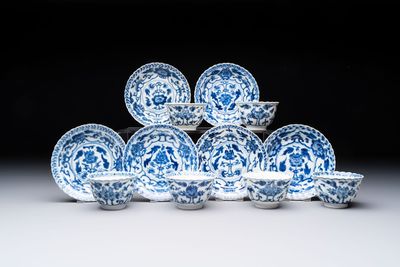 A set of six Chinese blue and white cups and saucers with floral design, Kangxi