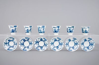 A set of six Japanese blue and white wine cups and saucers, 18/19th C.