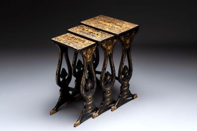 A set of three Chinese Canton gilt-lacquered nesting tables with narrative design, 19th C.