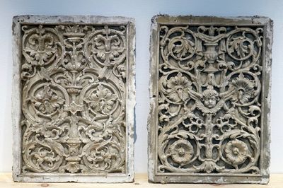 A set of two large ornamental plaster cast plaques, 19/20th C., Bruges