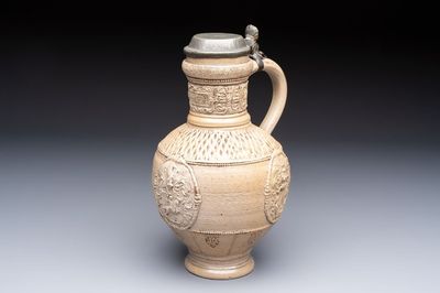 A Siegburg stoneware jug with mounted pewter lid, dated 1594