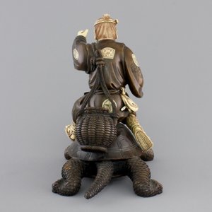 A signed Japanese carved ivory and wood figure of an immortal seated on a turtle, 19th C. — photo 4