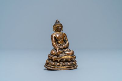 A Sino-Tibetan gilt bronze figure of Buddha Shakyamuni, Ming
