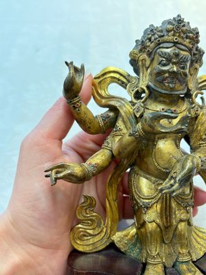 A Sino-Tibetan gilt-bronze figure of White Mahakala on wooden stand, 18th C. — photo 10