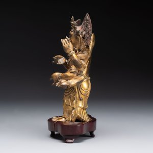A Sino-Tibetan gilt-bronze figure of White Mahakala on wooden stand, 18th C. — photo 2