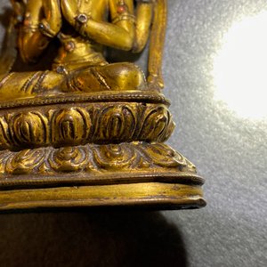 A Sino-Tibetan inlaid gilt bronze figure of Buddha, Ming — photo 30